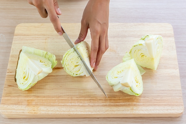cabbage and cutted cabbage on wooden - Постная запеканка с картофелем, грибами, капустой