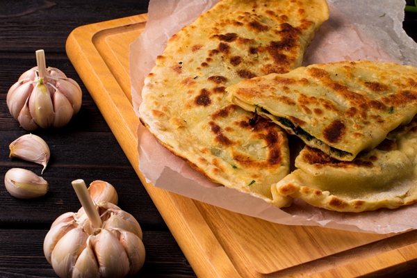 close up of flatbreads stuffed with herbs - Лобиани
