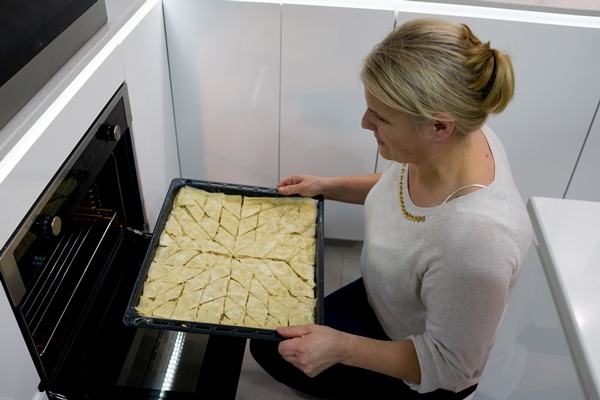 family making traditional sweet cake at home - Пахлава