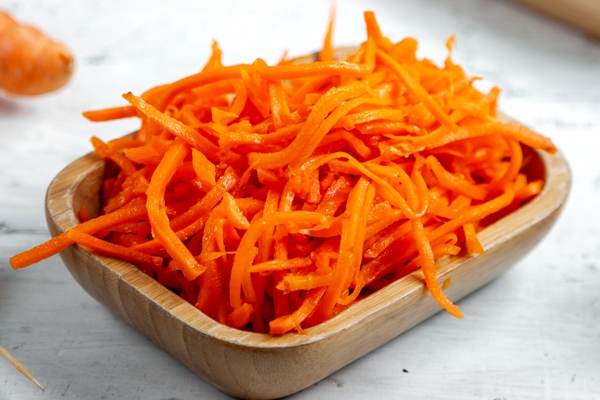 fresh carrot salad on the table - Салат из моркови с фруктами