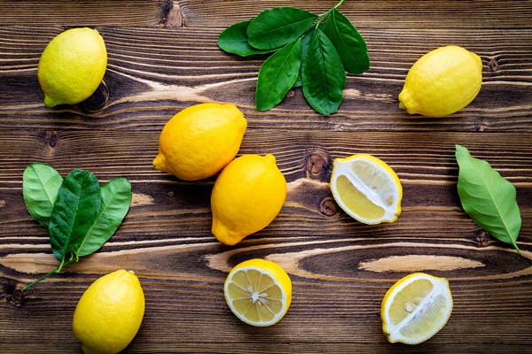 fresh lemons and lemons leaves on shabby wooden background - Постные прянички из битого теста