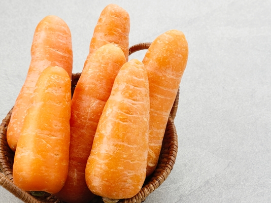 fresh organic carrots on grey background - Салат "Гранатовый браслет" постный