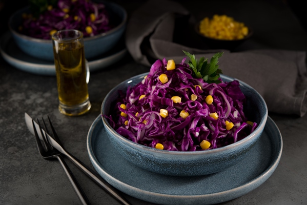 fresh vegetarian salad with red cabbage and corn on a dark grey surface 1 - Постный салат "Фиалка"