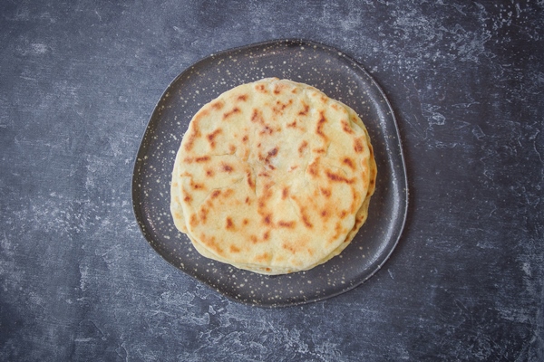 khychin tortilla traditional balkar food dark back - Лобиани