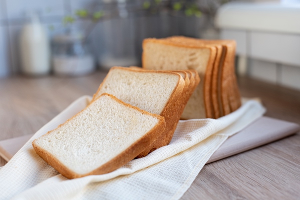 sliced toast bread on the table in the kitchen slices of white bread 1 - Новогодний бутерброд "Снеговик"
