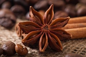 anise cinnamon and coffee beans on old wooden background - Кофе по-мексикански