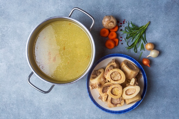 boiled bone and broth homemade beef bone broth is cooked in a pot on bones contain collagen which provides the body with amino acids which are the building blocks of proteins - Бульон с макаронными изделиями