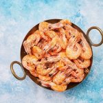 cooked fresh shrimps on a vintage dish over light blue background copy space flat lay - Киш с креветками и брокколи