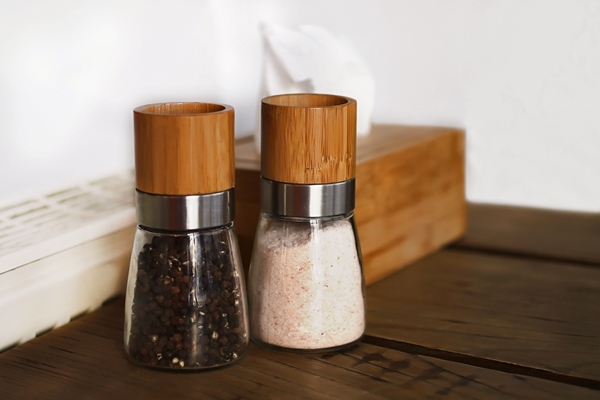 couple of spices on the table in the restraunt interior of the modern cafe wooden decor - Яичные котлеты по-карельски