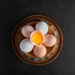 organic eggs and eggshells in a pottery bowl top view - Суп-пюре картофельный с молоком