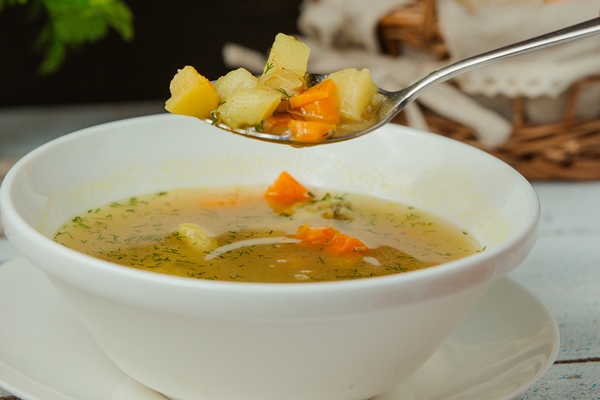 spoon with chicken soup with vegetables and dill - Картофельный суп с мясом