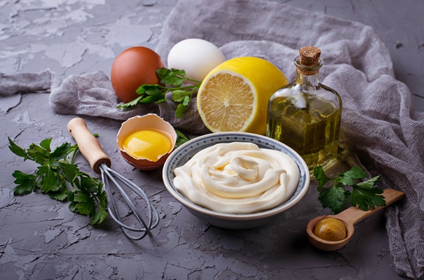 homemade mayonnaise sauce and olive oil eggs mustard lemon selective focus - Правила приготовления салатов