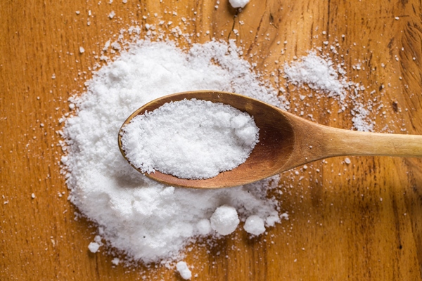 spoon and heap of salt on the table - Молочный суп с тыквой и рисом