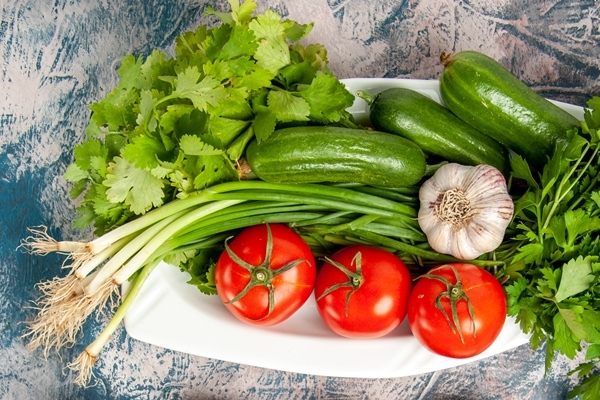 top view fresh green onion with vegetables and seasonings on the light blue background - Салат из крабов