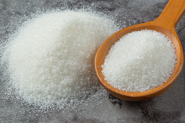 world diabetes day sugar in wooden bowl and stethoscope on dark background - Суп из клюквы и яблок со сметаной