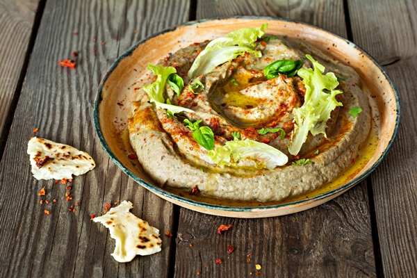 an oriental dish of baked eggplant babaganush eggplant puree - Хумус с печёным чесноком