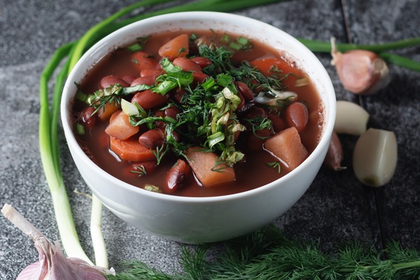 bean soup with herbs in a white bowl 2 - Монастырская кухня: суп из красной фасоли, драники