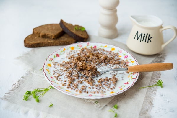 boiled buckwheat with milk on a plate traditional russian breakfast 1 - Пряная гречка без варки