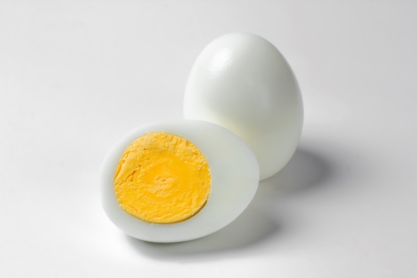 boiled chicken eggs on a white background - Блинчики с тунцом, рисом и яйцом