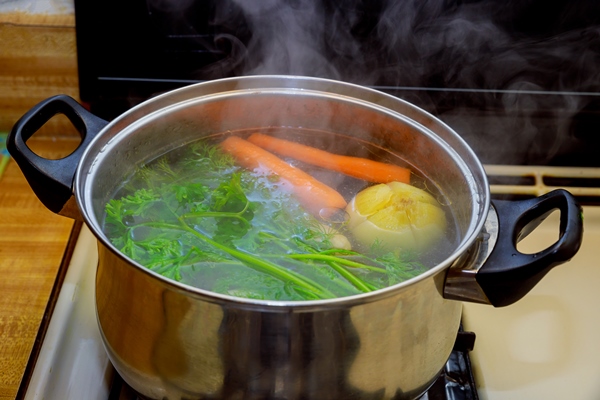 broth in a pot vegetable ingredients for a soup - Томатный соус к мясу