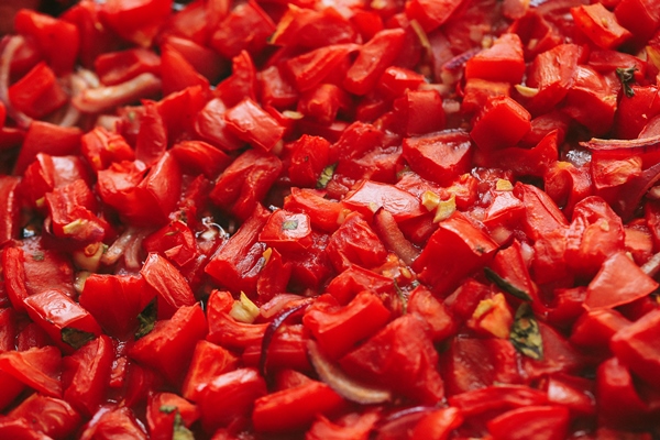 chopped red tomatoes with herbs in the stock - Икра овощная по-селянски