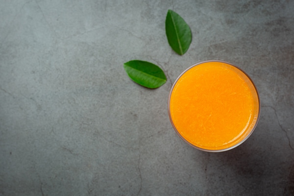 fresh orange juice in the glass on dark background - Монастырская кухня: суп из зелени и чинёная репа