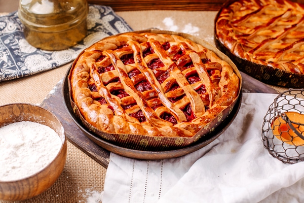 front view brown cherry pie tasty sweet delicious on the light floor - Сладкий дрожжевой пирог с ягодами