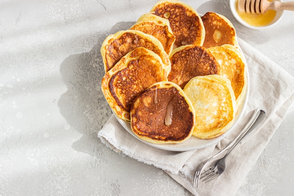 homemade pancakes with honey and sour cream 2 - Монастырская кухня: тыковник с черносливом и постные оладьи (видео)