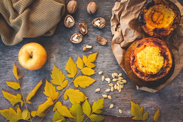 millet porridge baked in pumpkin walnut seeds apple yellow leaves warm sweater toned image top view 1 - Монастырская кухня: пшённая каша в тыкве, постное печенье на рассоле (видео)