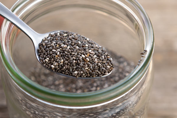 nutritious chia seeds on a spoon close up - Овсянка с манго, бананом и чиа