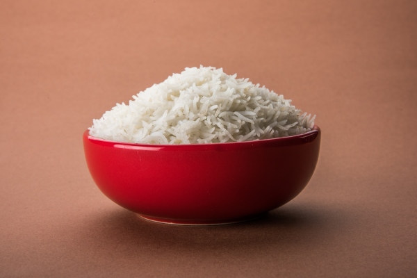 plain cooked indian white basmati rice in a ceramic bowl selective focus - Монастырская кухня: суп из помидоров, перец, фаршированный овощами (видео)