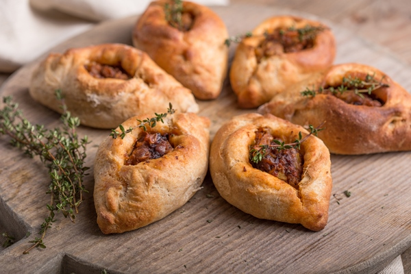 rasstegai pie with fish filling traditional meal of russian cuisine - Монастырская кухня: грибной бульон с расстегаями, кулеш