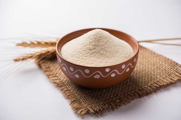 raw unprepared semolina flour also known as rava powder in hindi in bowl or spoon close up isolated on white or moody background selective focus 2 - Монастырская кухня: рис с баклажанами, ревани (видео)