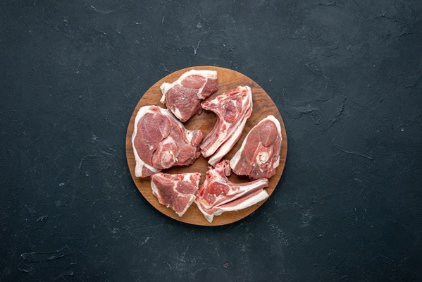 top view fresh meat slices raw meat on round wooden desk and dark food freshness animal cow meal food kitchen - Долма