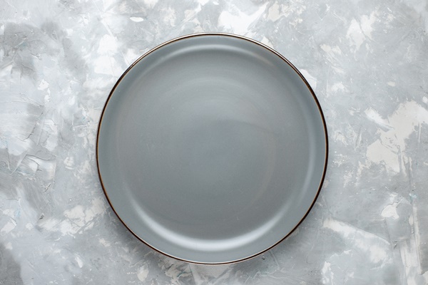 top view round empty plate grey colored on the light grey desk plate kitchen food color - Хумус из пророщенной гречки