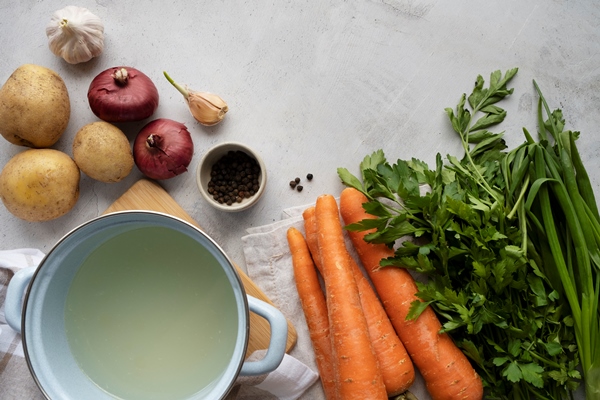 view of carrots in kitchen with other vegetables - Монастырская кухня: грибной бульон с расстегаями, кулеш