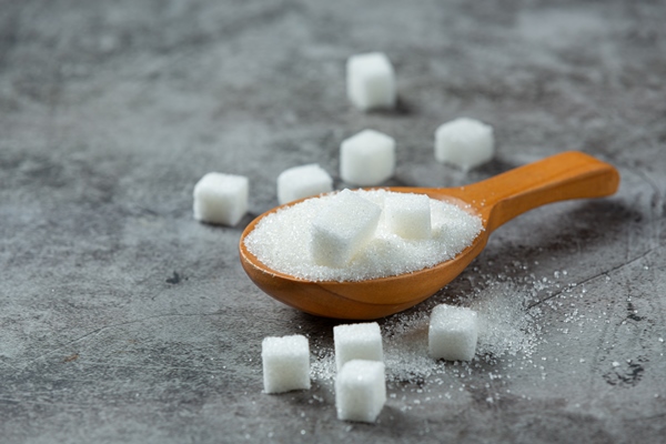 world diabetes day sugar in wooden bowl on dark surface 2 - Арахисовая паста с миндалём