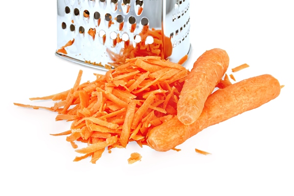 a pile of grated fresh carrots and two whole carrots metal grater isolated on white background - Лечебный стол (диета) № 3 по Певзнеру: таблица продуктов и режим питания