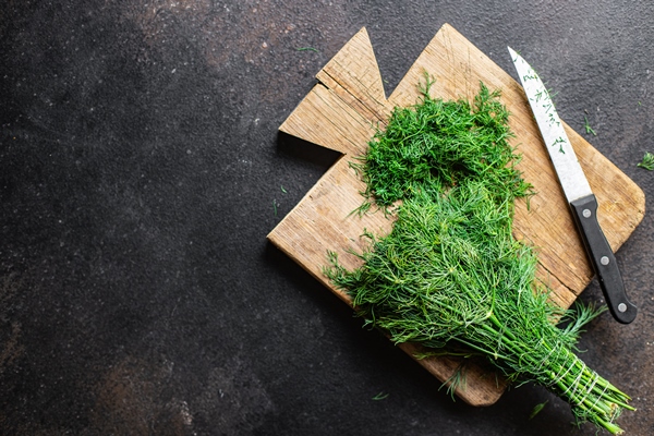 dill fresh green herb cut finely a knife on the table healthy snack copy space food background - Пирог с икрой
