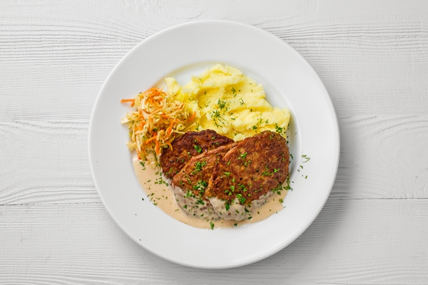 top view of plate with liver cutlet mashed potato and pickled cabbage - Особенности питания детей