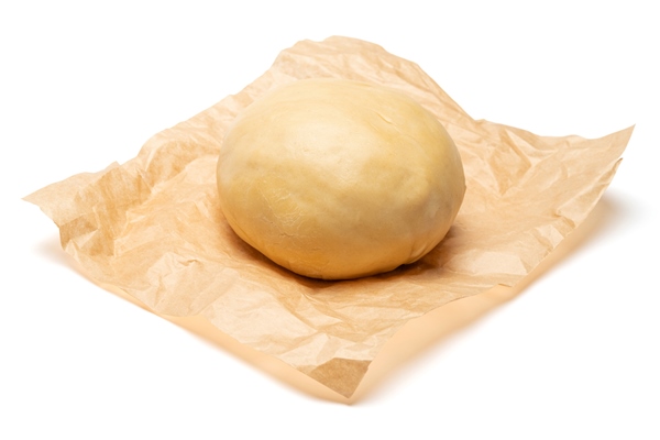 unrolled and unbaked shortcrust pastry dough on white background - Пастьера
