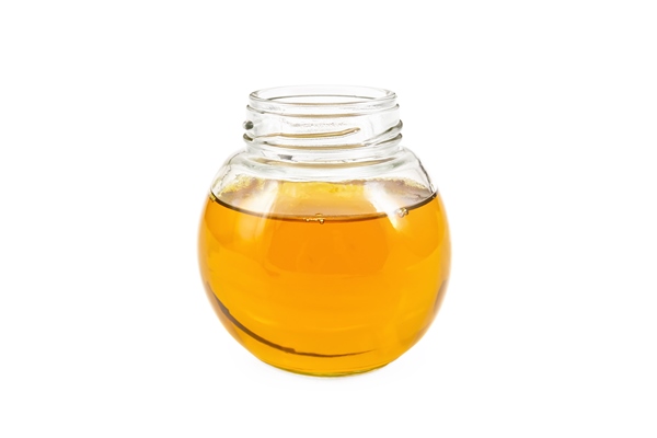 vegetable oil in glass jar isolated on white background - Карп по-краковски