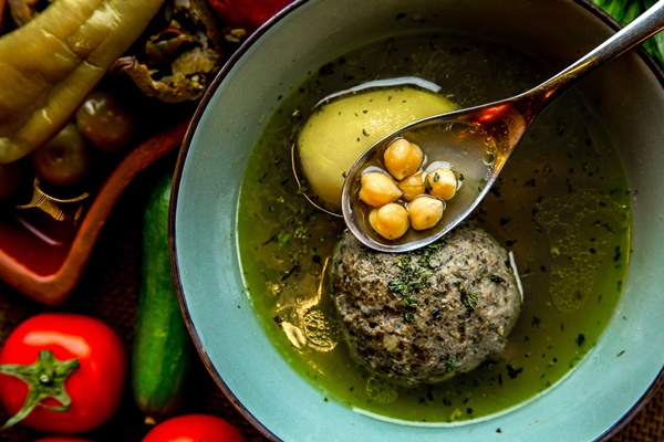 top view kufta bozbash soup traditional azerbaijani soup served with tomatoes and salted vegetables - Кюфта-бозбаш