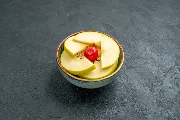front view fresh sliced apples inside little pot on grey background fresh fruit mellow ripe - Рыба, запечённая с яблоками и лимоном