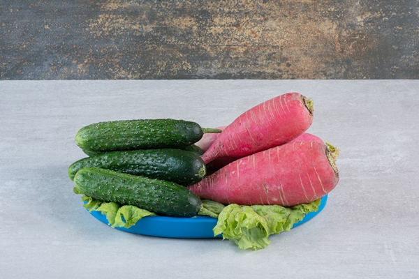 healthy cucumbers and red radishes on blue plate high quality photo - Окрошка на кефире с минеральной водой
