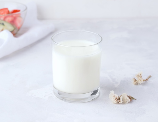 the concept of fermented drinks milk kefir in a glass on a concrete table healthy food - Окрошка на кефире с минеральной водой