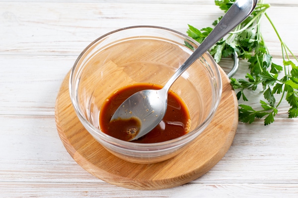 eggplant sauce in honey glaze in a glass bowl on a wooden table - Баклажаны в лимонно-медовой глазури