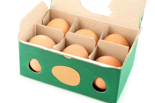 egg box with six brown eggs isolated on white surface - Салат "Тиффани" с курицей и виноградом