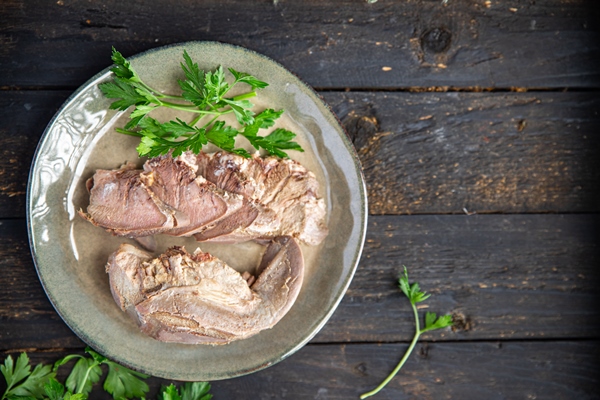 tongue pork cooked meat boiled fresh meal snack on the table copy space food background rustic - Салат мясной с солёными огурцами