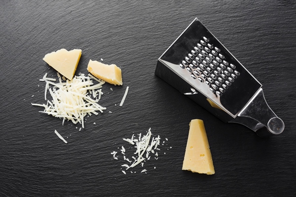 flat lay grated parmesan with grater - Салат "Тюльпаны"